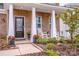 Inviting front porch with rocking chairs and landscaping at 127 Doncaster Dr, Mooresville, NC 28115