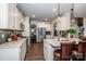 Modern kitchen with white cabinets, quartz countertops, and stainless steel appliances at 127 Doncaster Dr, Mooresville, NC 28115