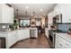 Modern kitchen with white cabinets, quartz countertops, and stainless steel appliances at 127 Doncaster Dr, Mooresville, NC 28115