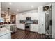 Modern kitchen with white cabinets, stainless steel appliances, and an island at 127 Doncaster Dr, Mooresville, NC 28115