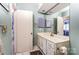 Simple bathroom with a single vanity and light teal walls at 1419 Jules Ct, Charlotte, NC 28226