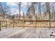 Spacious wooden deck overlooking a wooded backyard at 1419 Jules Ct, Charlotte, NC 28226