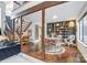 Dining area with a rustic wooden table and chairs, built-in shelving, and hardwood floors at 1419 Jules Ct, Charlotte, NC 28226