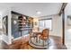 Charming dining room with wood floors, eclectic decor, and a round wooden table at 1419 Jules Ct, Charlotte, NC 28226