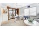 Home office with built-in shelving and a standing desk at 1419 Jules Ct, Charlotte, NC 28226