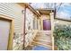 Front entrance with stone-clad exterior, wooden stairs, and a double door at 1419 Jules Ct, Charlotte, NC 28226