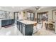 Open concept kitchen with island seating and access to a deck at 1419 Jules Ct, Charlotte, NC 28226