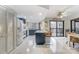 Modern kitchen with white appliances, a large island, and access to a deck at 1419 Jules Ct, Charlotte, NC 28226