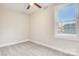 Bright bedroom with gray carpet, ceiling fan, and a large window at 1455 Southwest Blvd, Newton, NC 28658