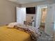 Bedroom with ensuite bathroom and patterned bedding at 1455 Southwest Blvd, Newton, NC 28658