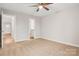 Bright bedroom with ceiling fan and access to bathroom and hallway at 1455 Southwest Blvd, Newton, NC 28658