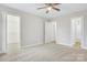 Large bedroom with ceiling fan and access to closets and bathroom at 1455 Southwest Blvd, Newton, NC 28658