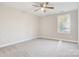 Spacious bedroom with ceiling fan and neutral-toned carpet at 1455 Southwest Blvd, Newton, NC 28658