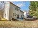 View of house exterior, showing backyard patio and lawn at 15011 Edindale Dr, Charlotte, NC 28277