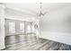 Elegant dining room with chandelier and hardwood floors at 15011 Edindale Dr, Charlotte, NC 28277