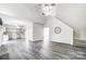 Open concept kitchen with gray cabinets and hardwood floors at 15011 Edindale Dr, Charlotte, NC 28277