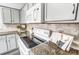 Close-up of kitchen stovetop and granite countertops at 15011 Edindale Dr, Charlotte, NC 28277