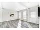 Bright living room with hardwood floors and neutral walls at 15011 Edindale Dr, Charlotte, NC 28277