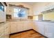 Bright kitchen features white cabinets, stainless steel sink and a decorative backsplash at 1715 Emmanuel Church Rd, Conover, NC 28613