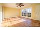 A brightly lit living room featuring hardwood floors, large window and a ceiling fan at 1715 Emmanuel Church Rd, Conover, NC 28613