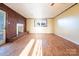 Bright living room with hardwood floors and a brick fireplace, perfect for gatherings at 1715 Emmanuel Church Rd, Conover, NC 28613