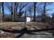 Large backyard with mature trees and storage shed at 1750 Oak Valley Dr, Gastonia, NC 28054