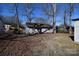 Large backyard with mature trees and storage shed at 1750 Oak Valley Dr, Gastonia, NC 28054