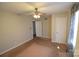 Simple bedroom with ceiling fan and neutral carpeting at 1750 Oak Valley Dr, Gastonia, NC 28054