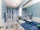 Bright blue bathroom with large mirror, decorative shower curtain, and modern fixtures at 1825 Bloomsbury Dr, Rock Hill, SC 29730