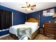 Bedroom with dark blue walls and wooden post bed at 1825 Bloomsbury Dr, Rock Hill, SC 29730