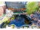 Backyard koi pond featuring a fountain, aquatic plants, and a variety of fish at 1825 Bloomsbury Dr, Rock Hill, SC 29730