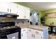 Well-lit kitchen featuring stylish white cabinetry and modern appliances at 1825 Bloomsbury Dr, Rock Hill, SC 29730