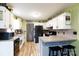 Open kitchen with breakfast bar and a view of the dining area at 1825 Bloomsbury Dr, Rock Hill, SC 29730