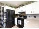 Modern kitchen with black appliances and white cabinets at 1825 Bloomsbury Dr, Rock Hill, SC 29730