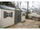 Beige and brown storage shed with double doors at 1825 Bloomsbury Dr, Rock Hill, SC 29730