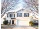 Two-story house with a white exterior, black shutters, and a two-car garage at 1866 Baylor Dr, Rock Hill, SC 29732