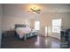 Large main bedroom with hardwood floors, a king-size bed, and ample natural light at 1866 Baylor Dr, Rock Hill, SC 29732