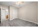 This bedroom features a ceiling fan, neutral paint, and durable wood-look flooring at 18736 Nautical Dr # 201, Cornelius, NC 28031