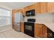 This kitchen features oak cabinets, modern appliances, and a large window for ample natural light at 18736 Nautical Dr # 201, Cornelius, NC 28031