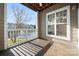 Inviting covered patio overlooking the lake, perfect for relaxing and enjoying the view at 18736 Nautical Dr # 201, Cornelius, NC 28031