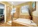 Bathroom with shower, soaking tub, and tile at 2012 Orby Ave, Indian Trail, NC 28079