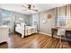 Bedroom with a metal bed frame, desk, and ceiling fan at 2012 Orby Ave, Indian Trail, NC 28079