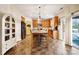 Kitchen with granite island, stainless steel appliances and access to backyard at 2012 Orby Ave, Indian Trail, NC 28079