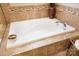 Relaxing soaking tub with tile surround at 2012 Orby Ave, Indian Trail, NC 28079