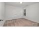 Simple bedroom with carpeted floors and window at 275 Broad Sw Dr, Concord, NC 28025