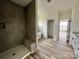 Modern bathroom with large walk-in shower and tile surround at 2906 Lathan Rd, Monroe, NC 28112