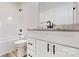 Modern bathroom featuring a white vanity with a light countertop and dark fixtures, complemented by a toilet and shower at 2906 Lathan Rd, Monroe, NC 28112