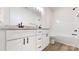 Bathroom with double vanity, granite countertops, black fixtures, and white cabinets at 2906 Lathan Rd, Monroe, NC 28112