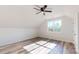 Bright bedroom with ceiling fan, large windows offering a scenic view, and wood-look flooring at 2906 Lathan Rd, Monroe, NC 28112