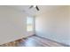 Bright bedroom featuring wood floors, a ceiling fan, a large window, and neutral paint at 2906 Lathan Rd, Monroe, NC 28112